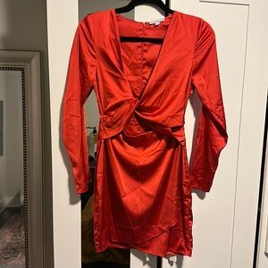 Wrap dress, zip closure. Exposed mid section.